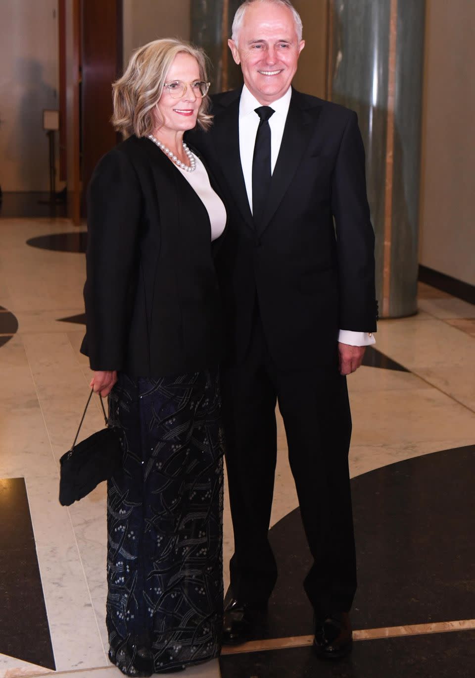 PM Malcolm Turnbull’s wife, Lucy, went for a more understated look in a wearing a long embroidered black skirt with a smart black blazer and white top..