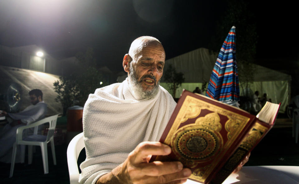 A Muslim pilgrim reads the Quran&nbsp;in the Saudi holy city of Mecca, on the eve of the Day of Arafat -- the climax of the Hajj pilgrimage.