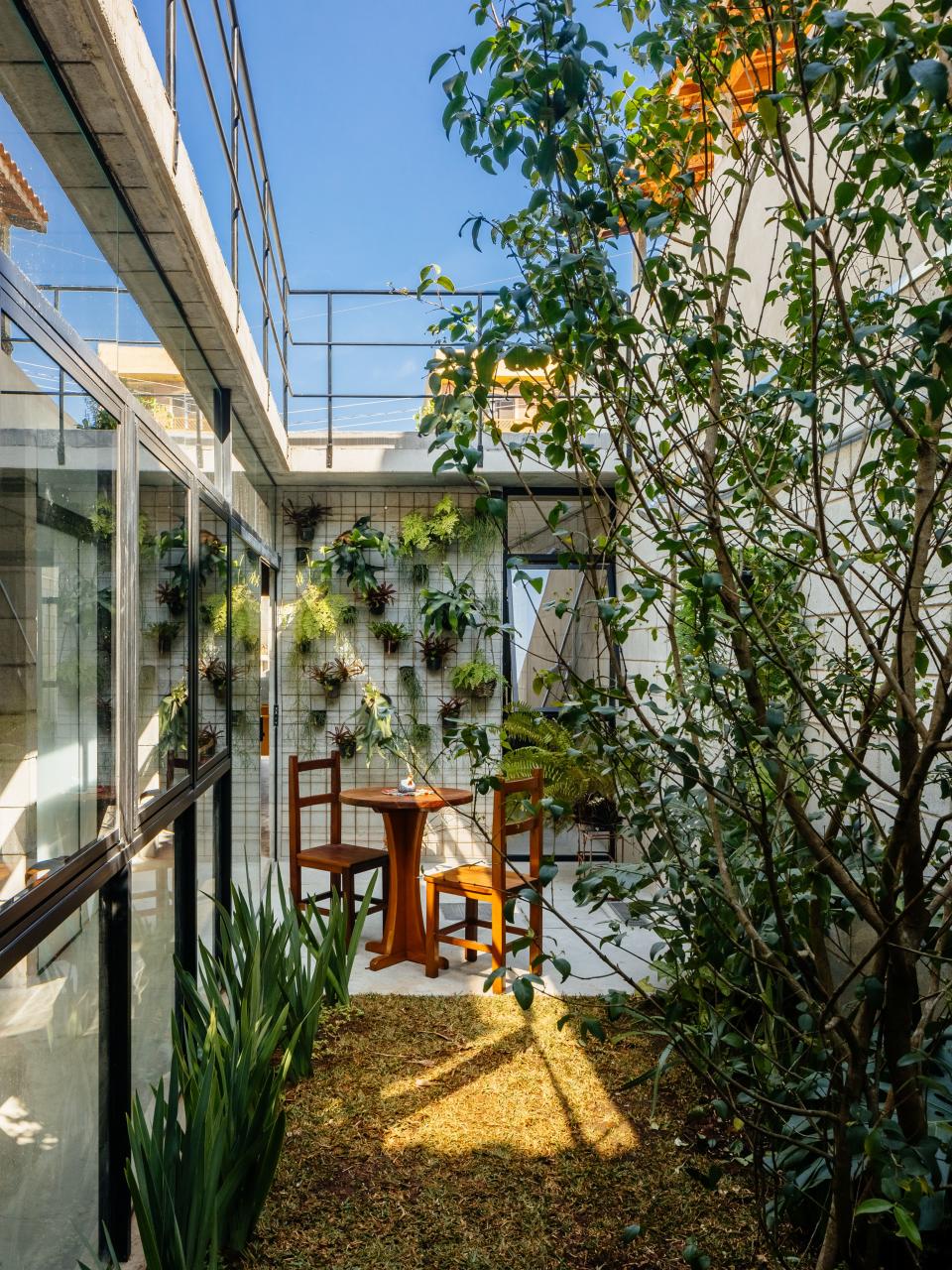 A small outdoor dining with lots of greenery