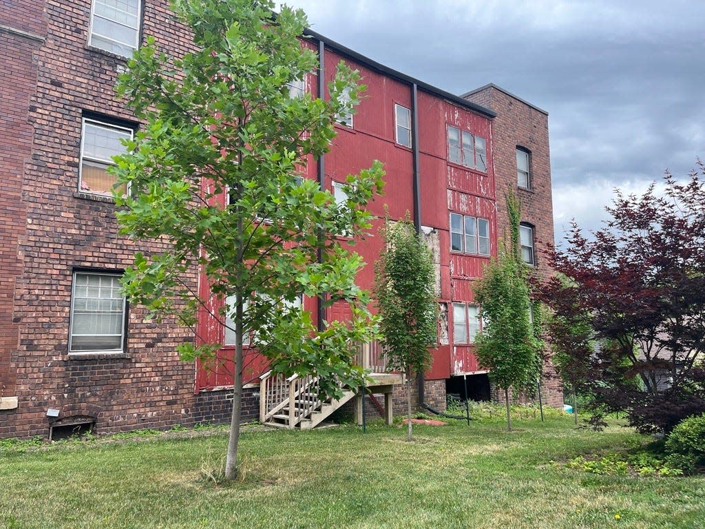 The back staircase at 1801 Pleasant St. has been cited as one of many housing violations over the past two years, according to city records.