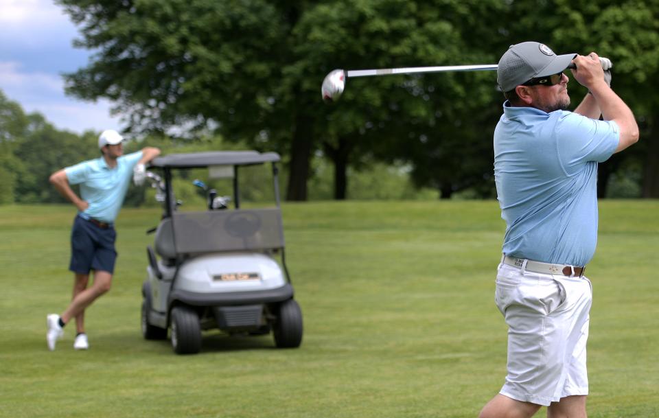 Ryan Riley watches his shot during Sunday's final round of the Walter Cosgrove Four Ball tournament at Green Hill.