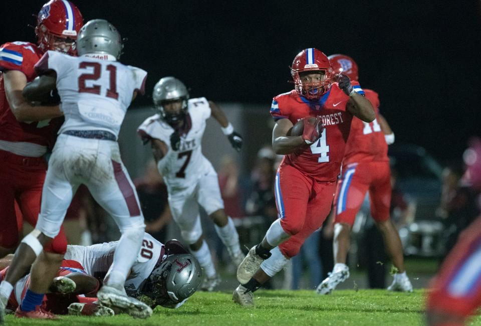 Kobe Johnson (4) carries the ball during the Tate vs Pine Forest football game at Pine Forest High School in Pensacola on Thursday, Aug. 25, 2022.