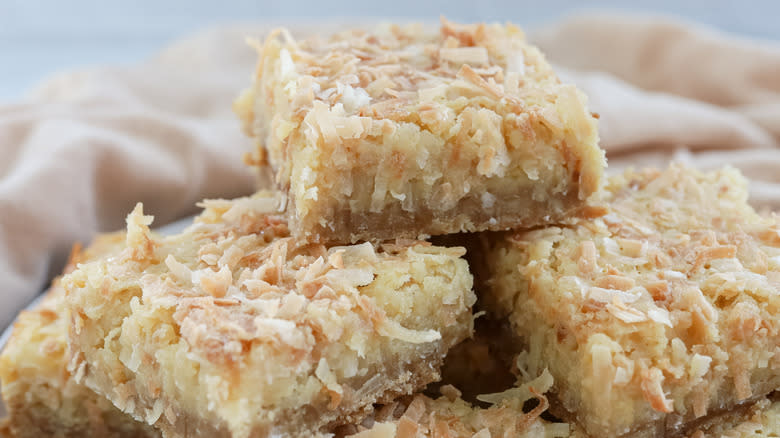 coconut bars cut up on a plate