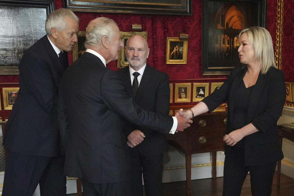 Britain's King Charles III meets Northern Ireland Assembly Speaker Alex Maskey, second left, and Sinn Fein Vice President Michelle O'Neil at Hillsborough Castle, Belfast, Tuesday Sept. 13, 2022. King Charles III and Camilla, the Queen Consort, flew to Belfast from Edinburgh on Tuesday, the same day the queen's coffin will be flown to London from Scotland. (Niall Carson/Pool Photo via AP)