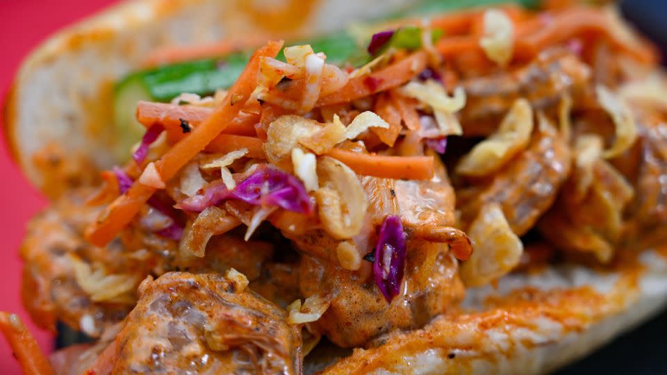 Gochugaru-marinated shrimp on a potato roll with kimchi slaw, gochujang mayonnaise and spicy pickle spear available at Sonoma Terrace during Lunar New Year at Disney California Adventure in Anaheim, California. - Jeff Gritchen/MediaNews Group/Orange County Register/Getty Images