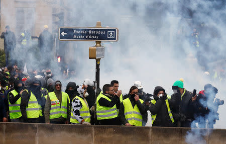 FILE PHOTO - Protesters wearing yellow vests take part in a demonstration by the "yellow vests" movement in Paris, France, January 5, 2019. REUTERS/Gonzalo Fuentes