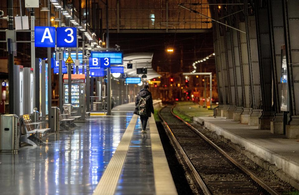 A man walks on a platform at the main train station in Frankfurt, Germany, Monday, March 27, 2023, during a nationwide public transport strike. (AP Photo/Michael Probst)