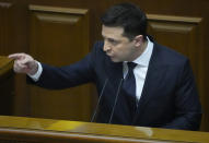 Ukrainian President Volodymyr Zelenskyy gestures as he addresses lawmakers in Kyiv, Ukraine, Wednesday, Dec.1, 2021. Ukraine marks the 30th anniversary of the referendum on independence. (AP Photo/Efrem Lukatsky)