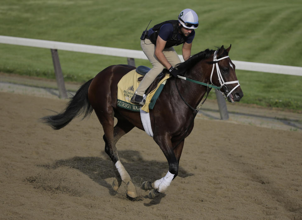 Exercise rider Jose Mejia rides Bourbon War during a workout at Belmont Park in Elmont, N.Y., Friday, June 7, 2019. The 151st Belmont Stakes horse race will be run on Saturday, June 8, 2019. (AP Photo/Seth Wenig)