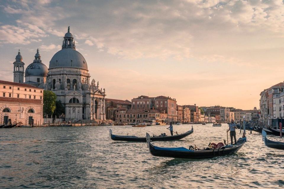 2 gondolas on the Venice waterfront