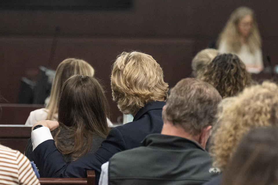 Caitlin Cash and Matt Wilson hold each other as Karen Wilson speaks about Anna Moriah Wilson to Kaitlin Armstrong after Armstrong was sentenced to 90 years in prison for Wilson's murder at the Blackwell-Thurman Criminal Justice Center on Friday, Nov. 17, 2023, in Austin, Texas. Armstrong was found guilty of killing Anna Moriah Wilson in May 2022. (Mikala Compton/Austin American-Statesman via AP, Pool)