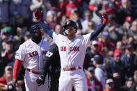 Boston Red Sox's Alex Verdugo celebrates after his triple in the first inning during an opening day baseball game against the Baltimore Orioles, Thursday, March 30, 2023, in Boston. (AP Photo/Charles Krupa)