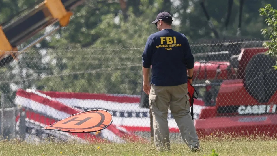 PHOTO: A member of the FBI Evidence Response Team, works near the building where a gunman was shot dead by law enforcement in Butler, Pennsylvania, July 15, 2024.  (Brendan Mcdermid/Reuters)