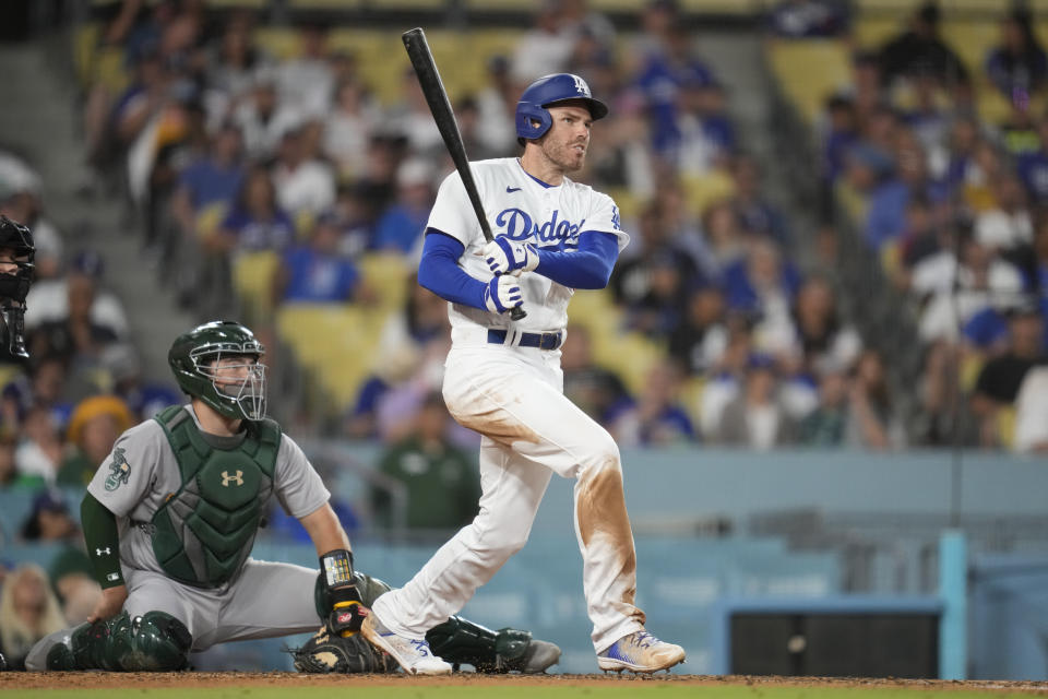 Los Angeles Dodgers' Freddie Freeman (5) doubles during the third inning of a baseball game against the Oakland Athletics in Los Angeles, Wednesday, Aug. 2, 2023. (AP Photo/Ashley Landis)