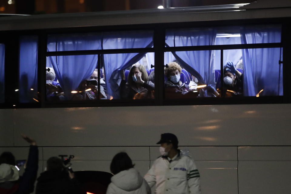 Buses carrying American passengers from the quarantined Diamond Princess cruise ship leave a port in Yokohama, near Tokyo, on Monday. (Photo: ASSOCIATED PRESS)