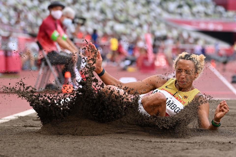 <p>Germany's Malaika Mihambo competes in the women's long jump qualification during the Tokyo 2020 Olympic Games at the Olympic Stadium in Tokyo on August 1, 2021. (Photo by Andrej ISAKOVIC / AFP)</p> 