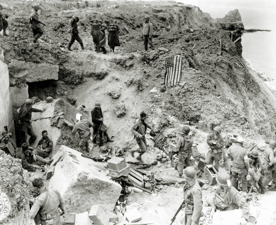 After the attack on the cliffs of Pointe du Hoc by the 2nd Ranger Battalion, German prisoners were collected and an American flag was used for signaling in June 1944.  (Galerie Bilderwelt / Getty Images)