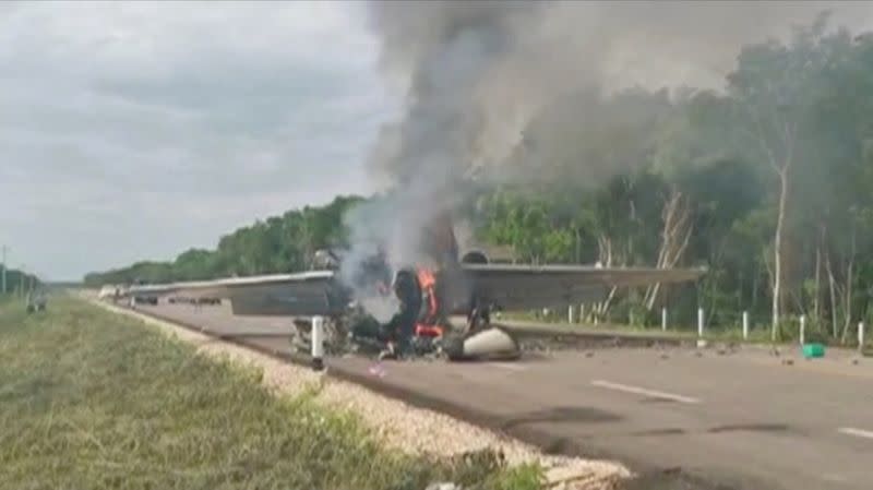 Video grab of a plane suspected of carrying drugs that was reportedly set alight after allegedly being intercepted by soldiers on Federal Highway 184 in Quintana Roo state, Mexico