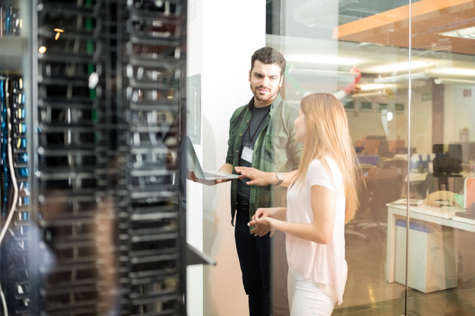 Two people in a data center