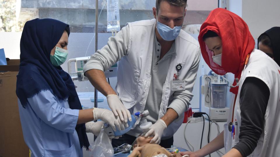 <div class="paragraphs"><p>Dr Bart Scharuwen, nursing activity manager Jane Hancock and nurse Marzia perform cardiopulmonary resuscitation on a malnourished baby with asthma, who sadly passed away, in the operating room of Herat regional hospital. (Afghanistan, December 2020.)</p></div>