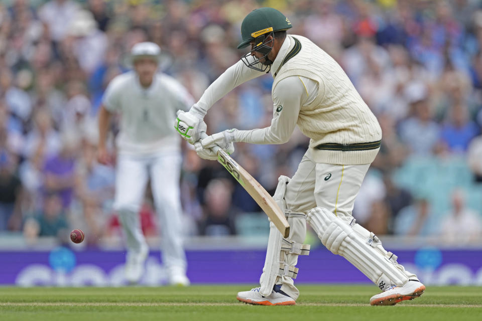 Australia's Usman Khawaja plays a shot during the second day of the fifth Ashes Test match between England and Australia at The Oval cricket ground in London, Friday, July 28, 2023. (AP Photo/Kirsty Wigglesworth)