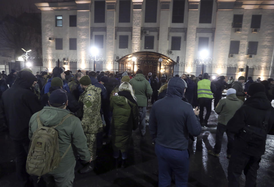 Activists attend a rally in front of the Russian embassy building in Kiev, Ukraine, Sunday, Nov. 25, 2018. Russia's coast guard opened fire on and seized three of Ukraine's vessels Sunday, wounding two crew members, after a tense standoff in the Black Sea near the Crimean Peninsula, the Ukrainian navy said. (AP Photo/Efrem Lukatsky)