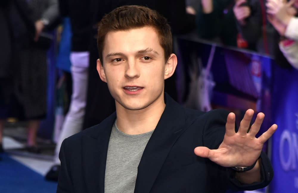 Tom Holland has been left with a red bruise on his forehead from the golf ball credit:Bang Showbiz