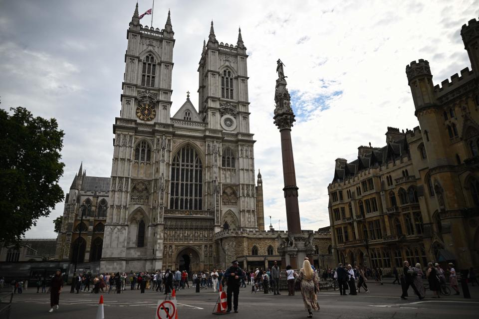 A general view of the Britain national flag flying half mast at the Westminster Abbey, central London on September 12, 2022, following the death of Queen Elizabeth II on September 8. (Photo by Marco BERTORELLO / AFP) (Photo by MARCO BERTORELLO/AFP via Getty Images)