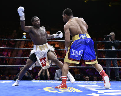 Adrien Broner (L) and Shawn Porter battle during a welterweight fight on Saturday. (AP)