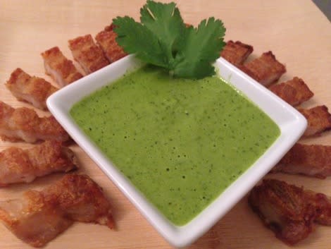 Chicharrón served with green chile salsa to dip.