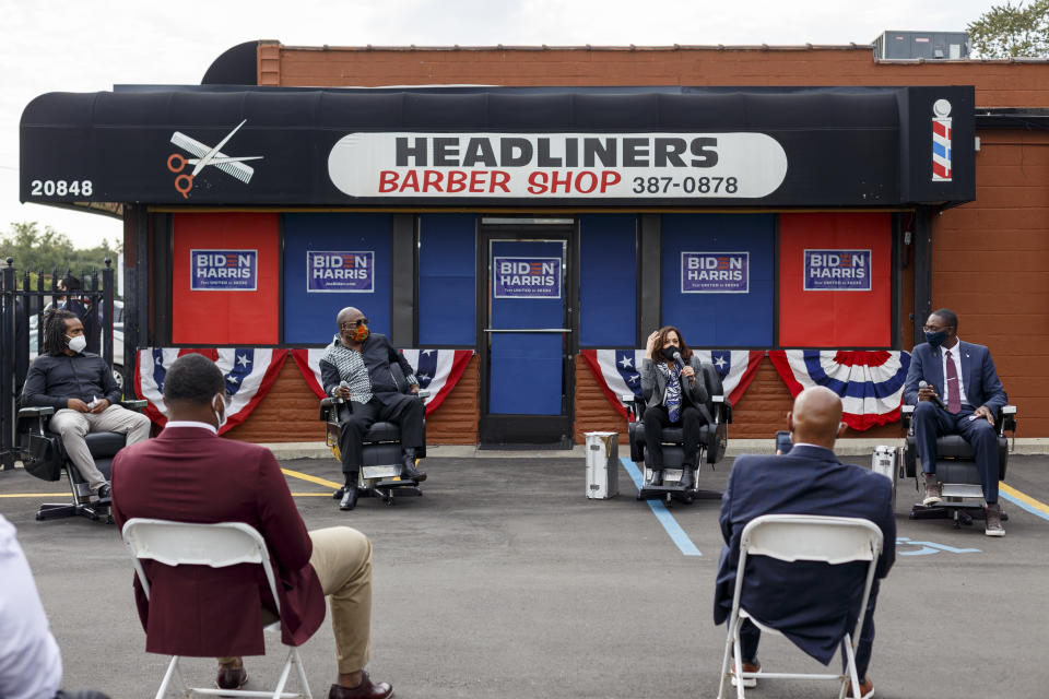 DETROIT, MI - SEPTEMBER 22:  (L-R) Anthony Donald, Jr., owner of Headliners Barber Shop; the Reverend Wendell Anthony; Democratic U.S. vice presidential nominee, Sen. Kamala Harris (D-CA); and Michigan Lt. Gov. Garlin Gilchirst talk during a campaign inititive dubbed Shop Talk  at Headliners Barber Shop on September 22, 2020 in Detroit, Michigan. Harris is making her first visit to Michigan since being tapped by Democratic presidential nominee Joe Biden as his running mate.  (Photo by Elaine Cromie/Getty Images)