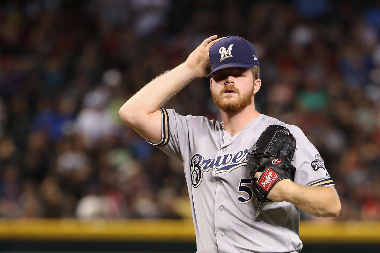 PHOENIX, ARIZONA - JULY 21:  Starting pitcher Brandon Woodruff #53 of the Milwaukee Brewers reacts after giving up a two-run home run to Alex Avila (not pictured) of the Arizona Diamondbacks during the second inning of the MLB game at Chase Field on July 21, 2019 in Phoenix, Arizona. (Photo by Christian Petersen/Getty Images)