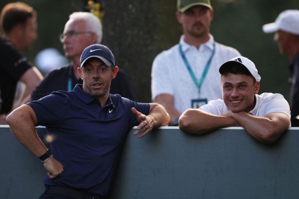 Rory McIlroy and Ludvig Aberg wait on the 17th tee late on the second day of the BMW PGA Championship at Wentworth Club. Picture: Richard Heathcote/Getty Images.