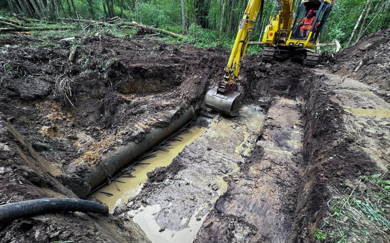 Southern Water workers prepare to fix the burst pipe