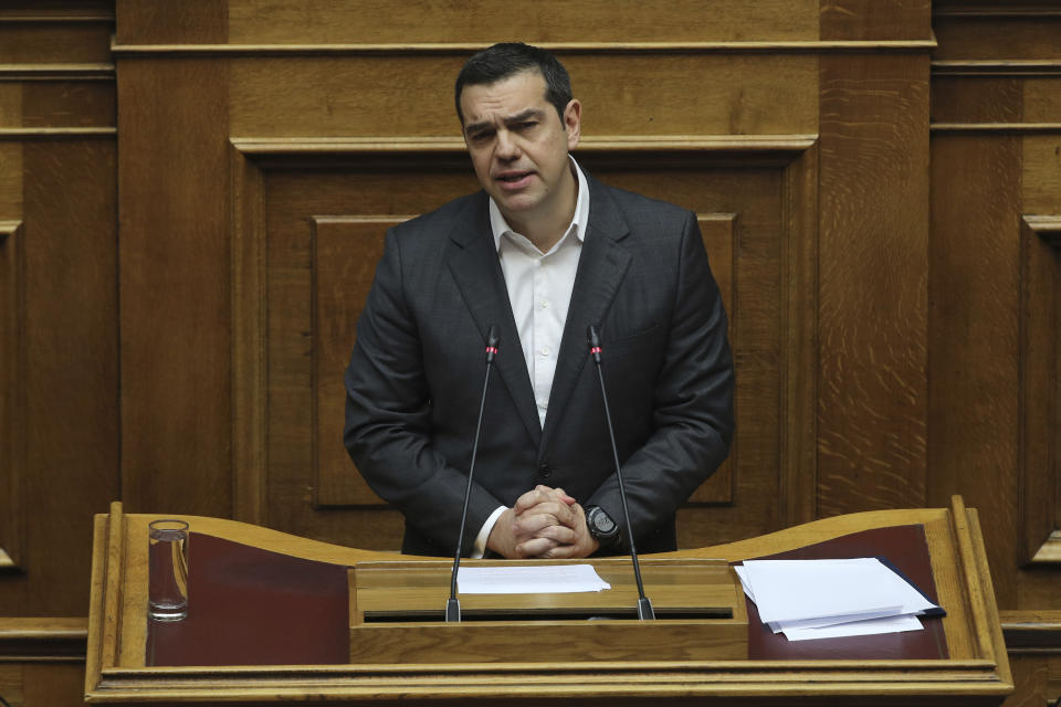 Greek Prime Minister Alexis Tsipras speaks during a parliamentary session in Athens, on Tuesday, Jan. 15, 2019. Greece's prime minister is defending his deal to normalize relations with neighboring Macedonia ahead of a confidence vote in parliament after his governing coalition collapsed over the agreement. (AP Photo/Petros Giannakouris)