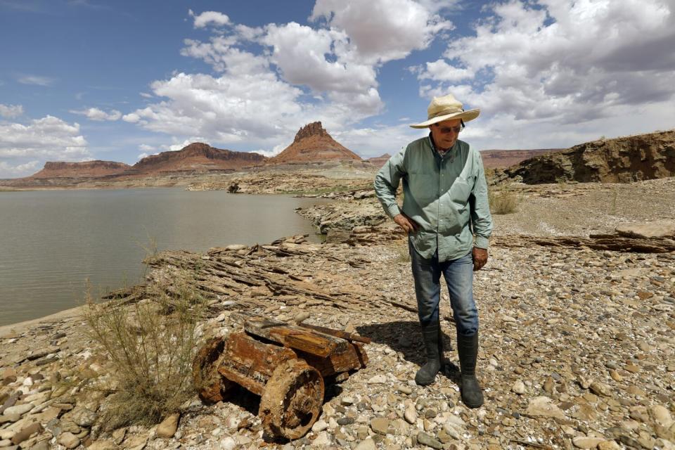 A man walks by a river