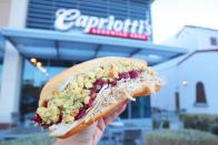 <p><strong>Thanksgiving Sub </strong><br><br>The easiest way to describe this sandwich is taking all of the fixings of Thanksgiving dinner and putting it into a sub. Invented by Delaware’s <a href="https://www.capriottis.com/" rel="nofollow noopener" target="_blank" data-ylk="slk:Capriotti’s Sandwich Shop;elm:context_link;itc:0;sec:content-canvas" class="link ">Capriotti’s Sandwich Shop</a> more than 40 years ago, it’s made with house-roasted turkey, stuffing, cranberry sauce and mayo. It’s a personal favorite by Joe Biden.</p>