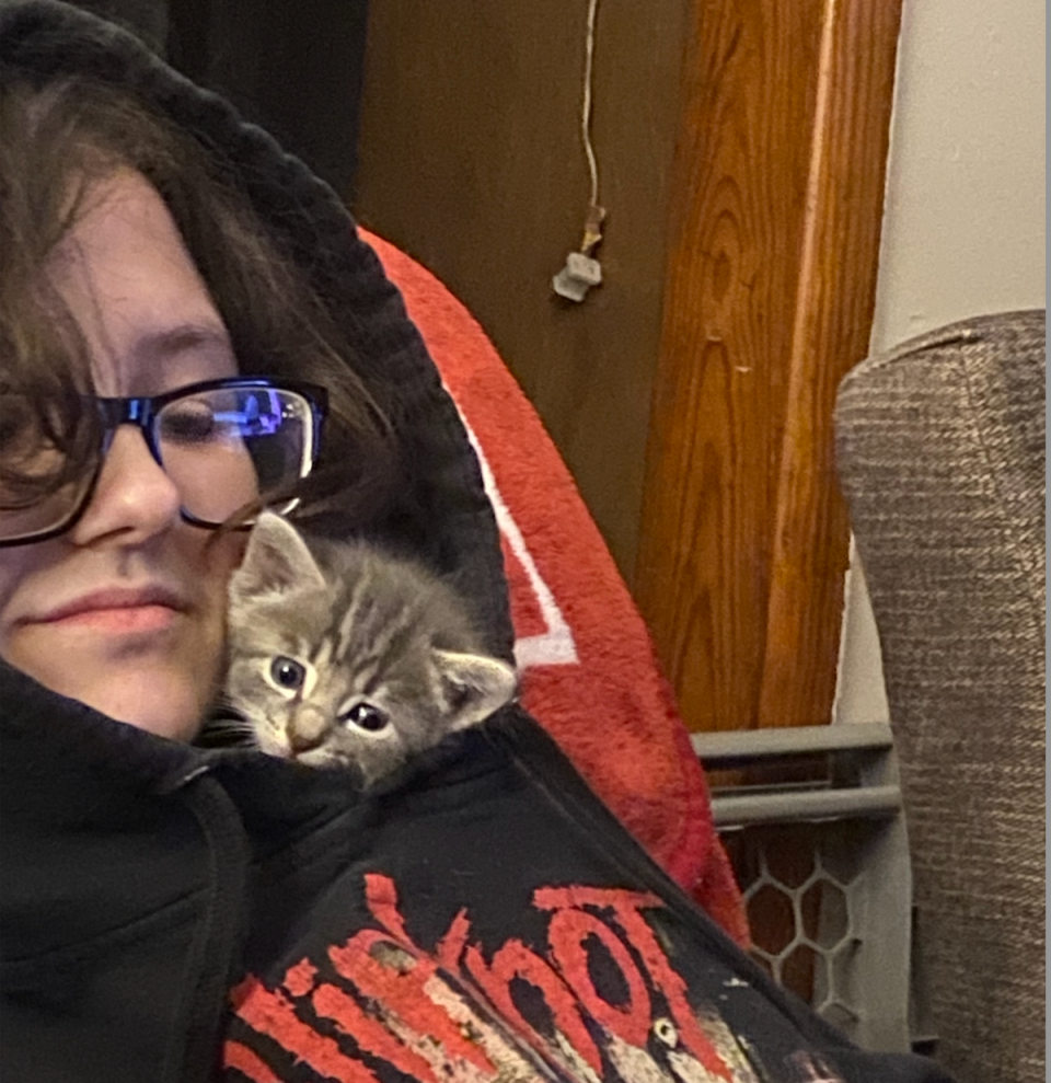 Nex Benedict with their cat Zeus; the teen is being mourned not just by family but also by countless around the world, the death shining a spotlight on anti-trans legislation in Oklahoma (Courtesy of Benedict family)