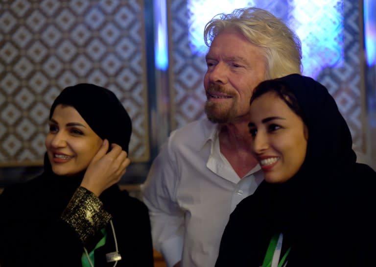 Founder of Virgin group Sir Richard Branson poses with Saudi women during last year's "Future Investment Initiative" in Riyadh; Branson is another key personality to have withdrawn from this year's event