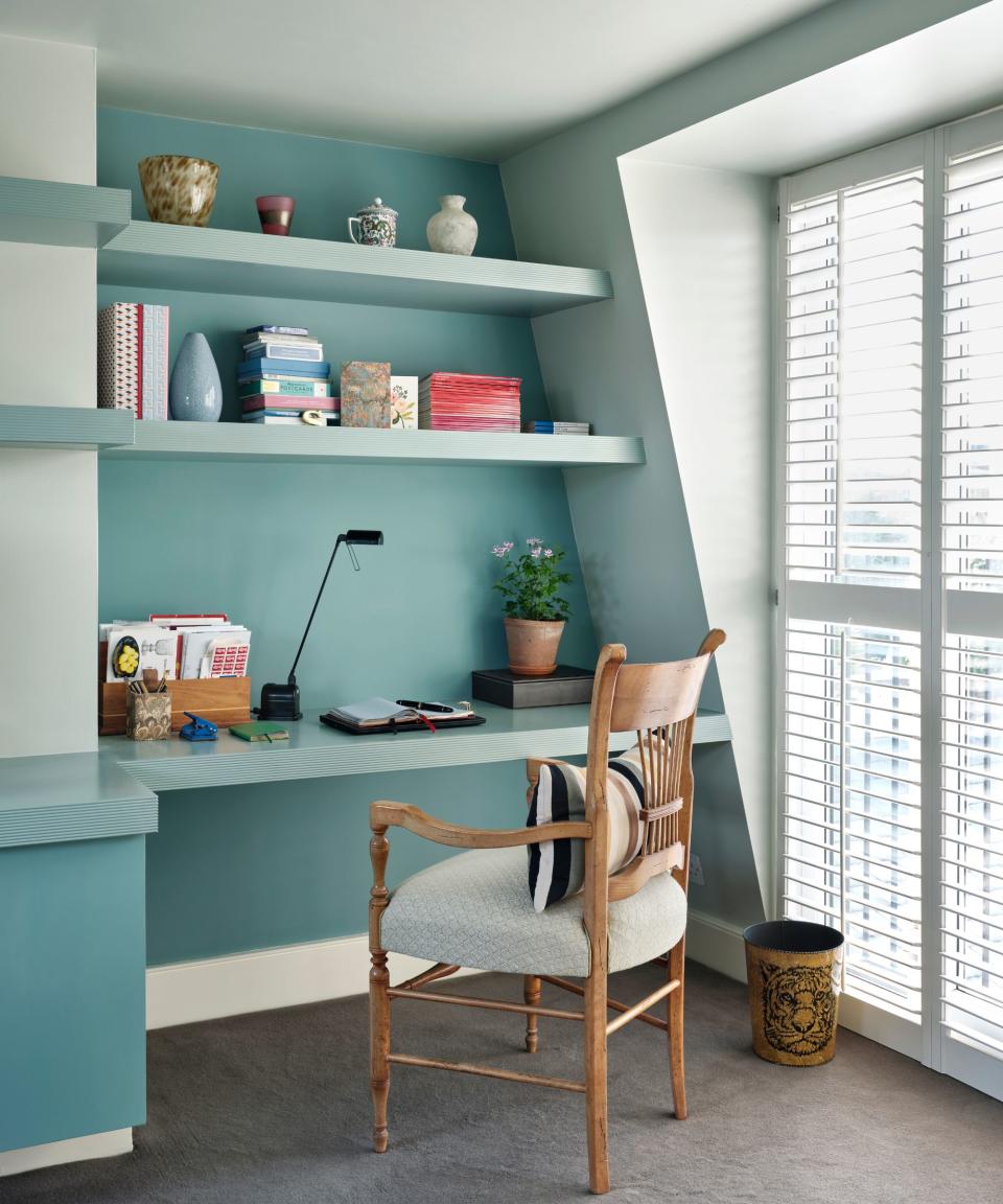 Blue and white home office, wooden chair, shutters