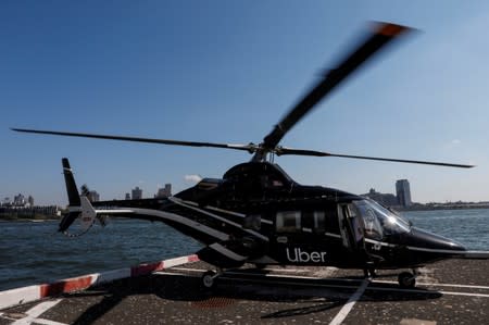 FILE PHOTO: A helicopter operated by Uber Copter, a new service by the ride-sharing company Uber, in Manhattan in New York