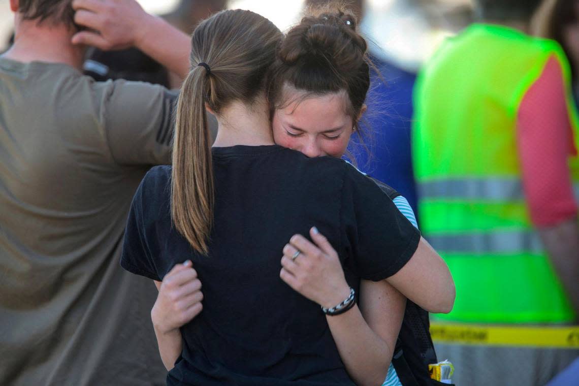 Students embrace after a school shooting at Rigby Middle School in May 2021. A 12-year-old girl was arrested.