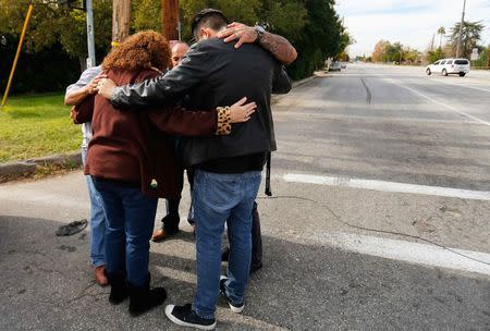 Local residents as they wait to return to their homes near the scene of the investigation of an SUV where two suspects were shot by police following a mass shooting in San Bernardino, California December 3, 2015. REUTERS/Mike Blake/File Photo