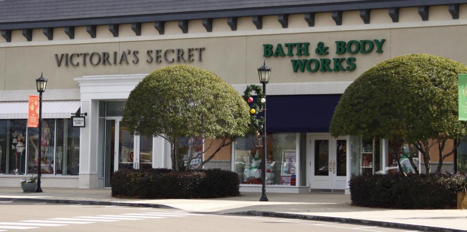 A Victoria's Secret store and a Bath & Body Works store, both part of the Limited Brands corporation, are open and waiting for customers. (AP Photo/Rogelio V. Solis)