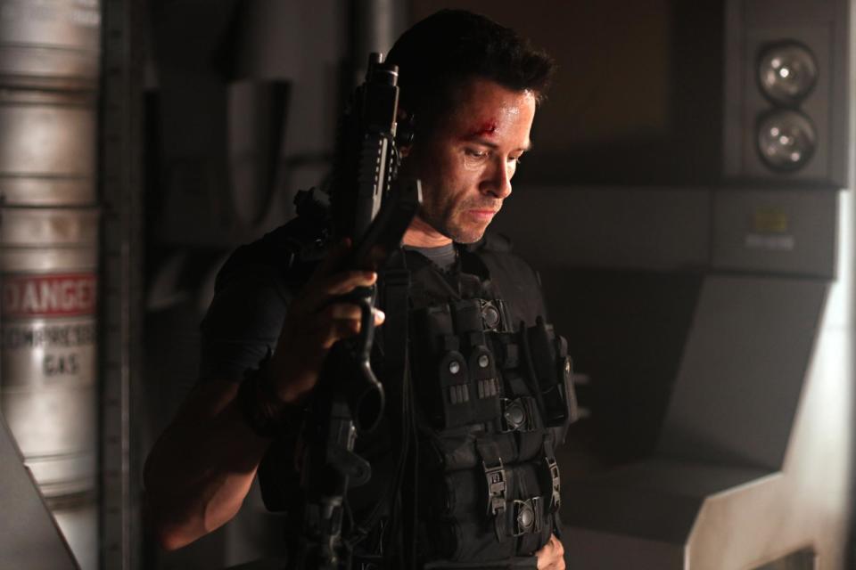 In this film image released by Film District, Guy Pearce is shown in a scene from "Lockout." (AP Photo/Film District)