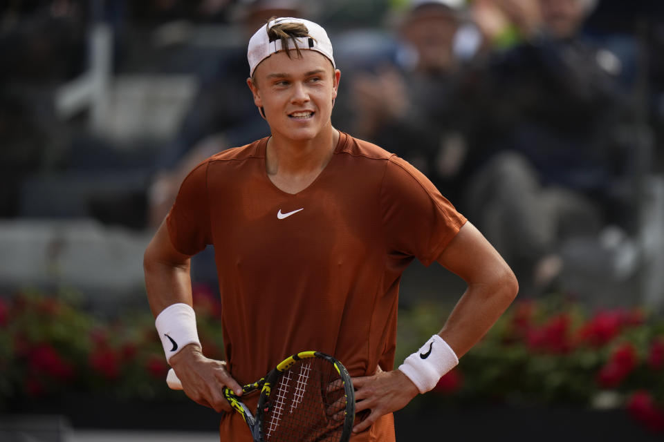 Denmark's Holger Rune is dejected after losing a point to Daniil Medvedev of Russia during the men's final tennis match at the Italian Open tennis tournament in Rome, Italy, Sunday, May 21, 2023. (AP Photo/Alessandra Tarantino)