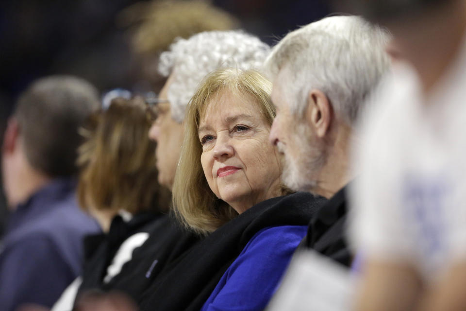 FILE - In this Nov. 17, 2019, file photo, St. Louis Mayor Lyda Krewson sits during an NCAA college basketball game between Saint Louis and Seton Hall in St. Louis. Krewson was elected on a pledge to address the violence that ravages her city. Amid that backdrop, it’s not surprising that calls to defund police don’t sit well with her. Yet Krewson’s decision to publicly reveal the names and addresses of anti-police protesters has put her among the big city mayors facing closer scrutiny in the racially charged weeks after George Floyd’s death. (AP Photo/Jeff Roberson, File)