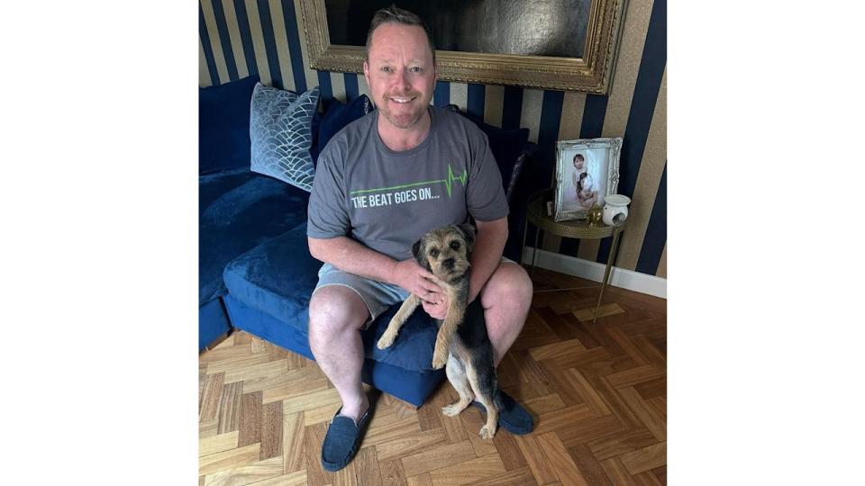 John Cameron at home with his dog Polly