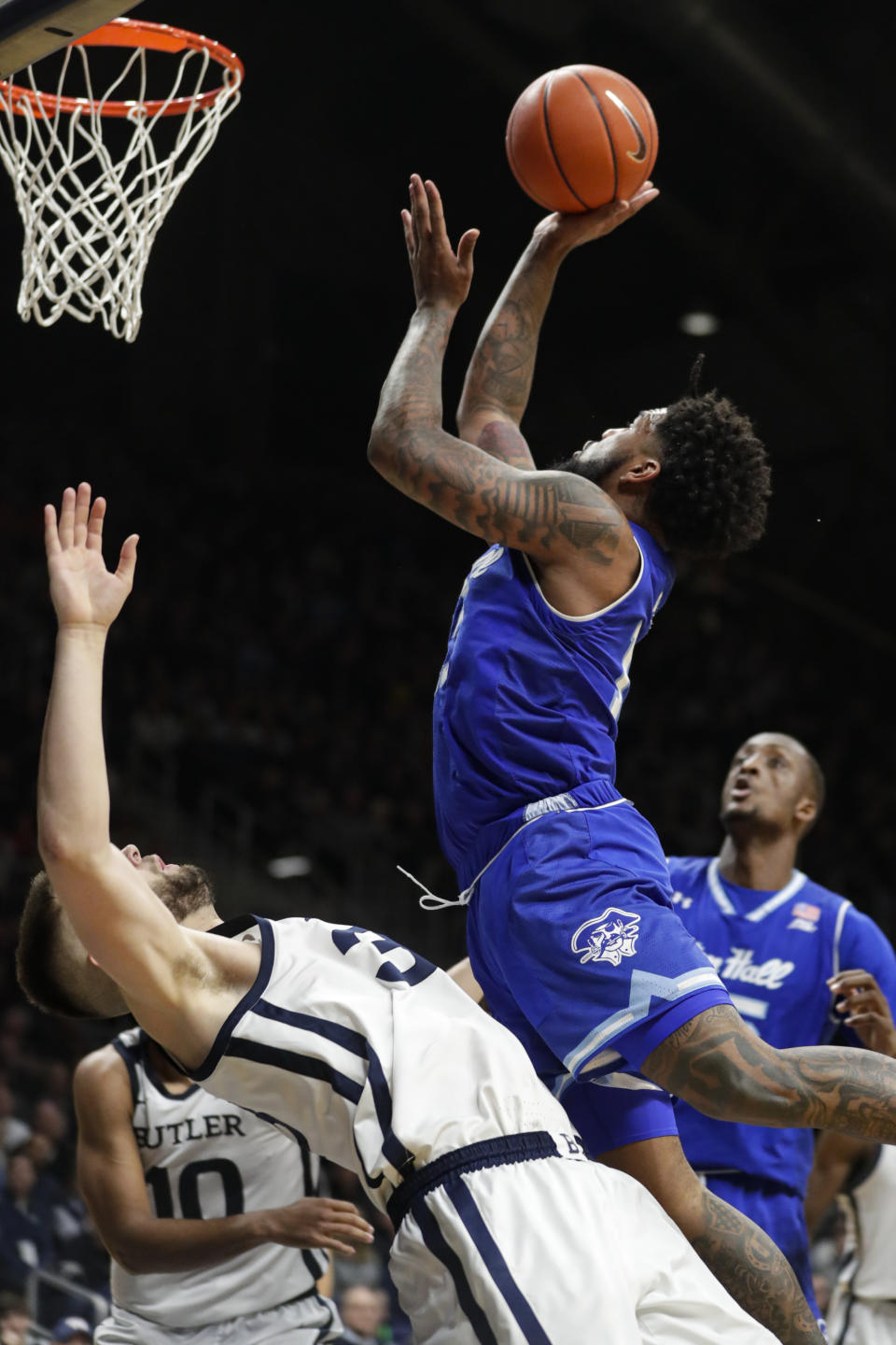 Seton Hall guard Myles Powell (13) shoots over Butler forward Bryce Golden (33) in the second half of an NCAA college basketball game in Indianapolis, Wednesday, Jan. 15, 2020. Seton Hall defeated Butler 78-70. (AP Photo/Michael Conroy)