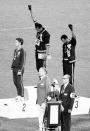 <p>During the medal ceremony for the 200-meter race, American athletes John Carlos and Tommie Smith wore black gloves and made the gesture to mimic the Black Power salute. (Their shoeless, socked feet was to represent black poverty.) It was quite the political statement about civil rights, and one that got them kicked out of the games by the IOC chair. (Little known fact: the silver medalist, Australian Peter Norman, may look like he's not participating, but he's actually making a very big statement too by wearing a human rights badge on his uniform. Thirty-eight years later when Norman died, both Carlos and Smith were pallbearers at his funeral.)</p>
